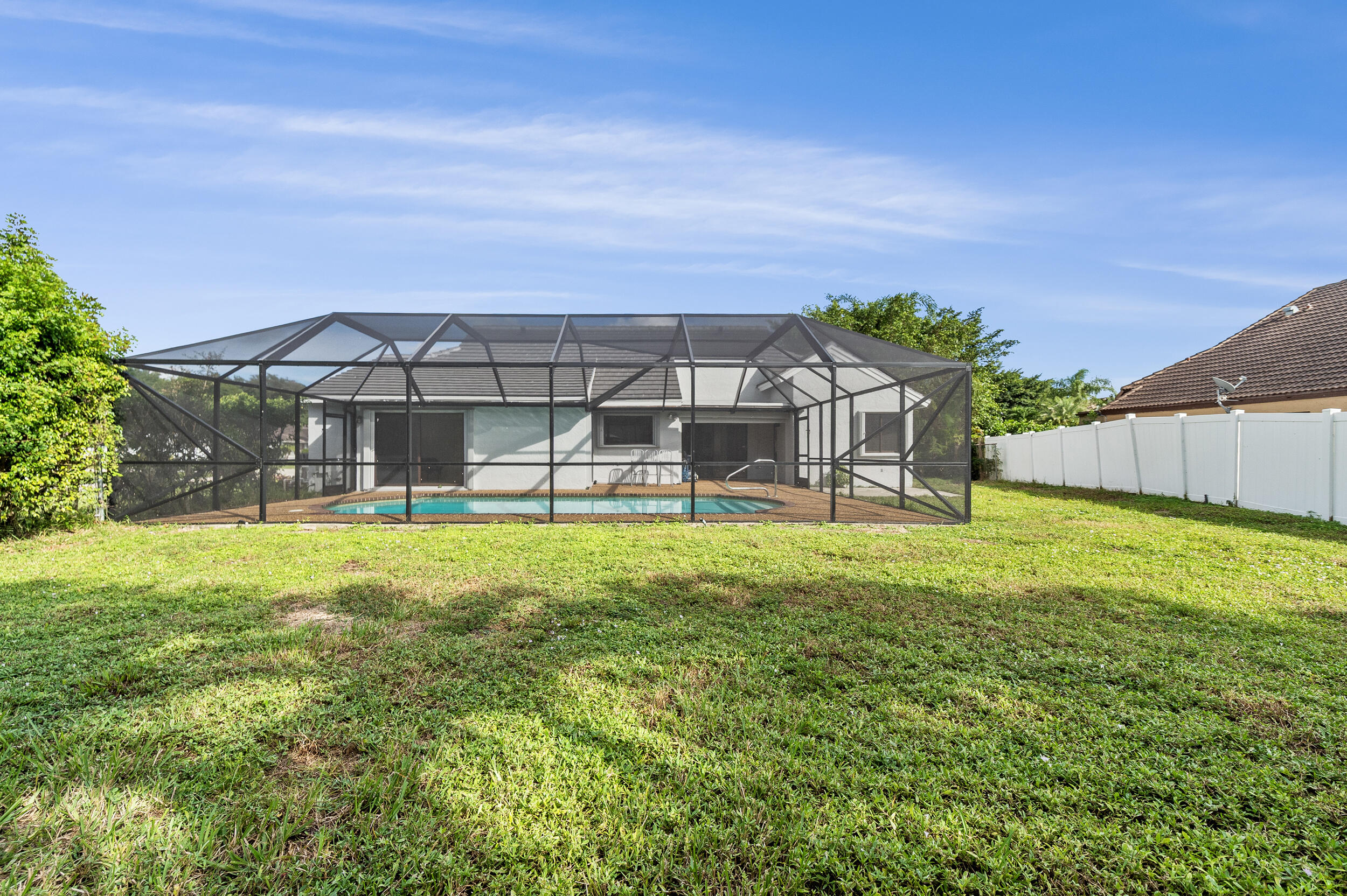 22301 Ensenada Way Boca Raton, FL 33433 - Photo 3 of 44 a view of a house with a backyard