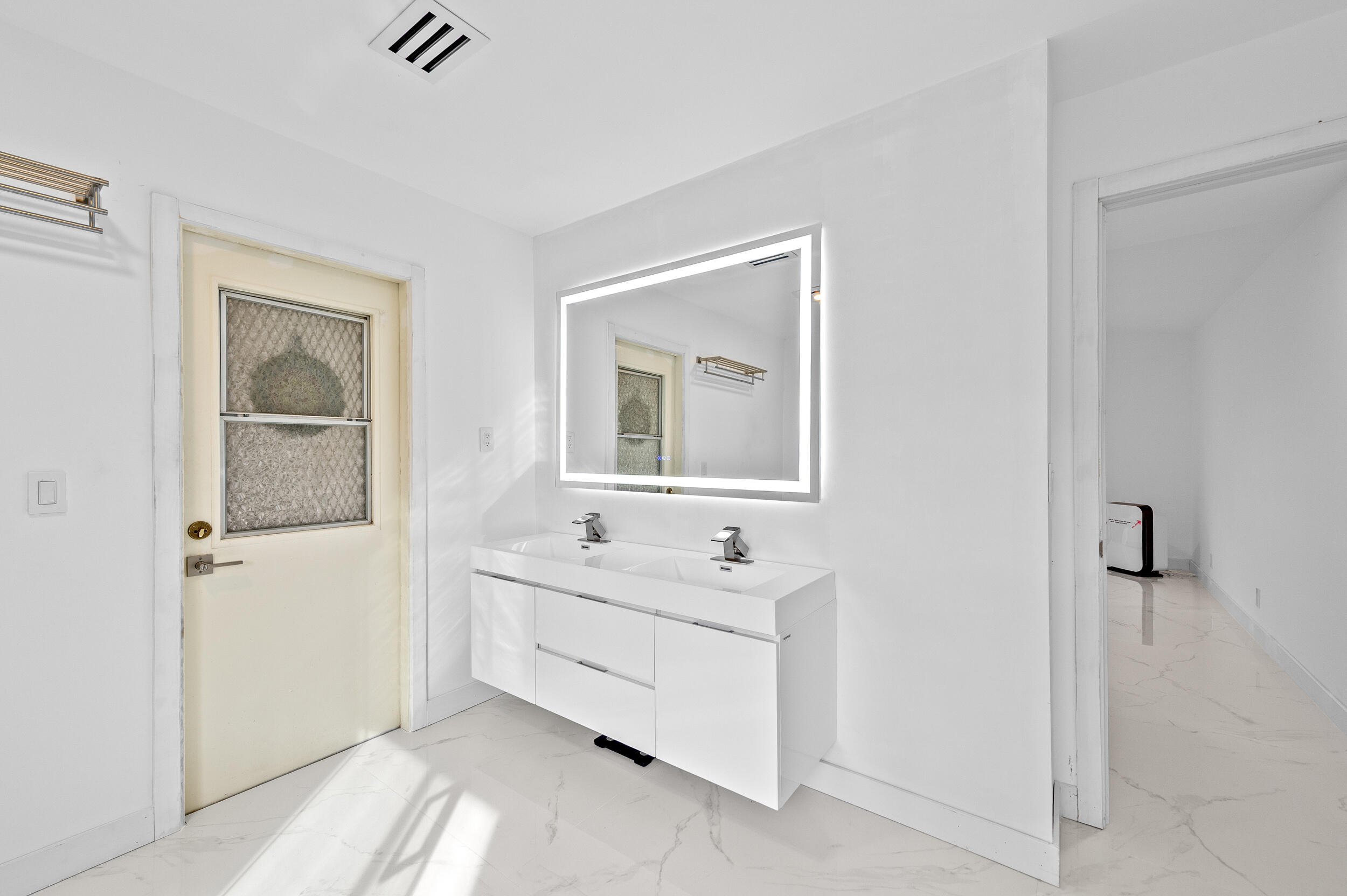 22301 Ensenada Way Boca Raton, FL 33433 - Photo 31 of 44 a bathroom with a double vanity sink mirror and bathtub