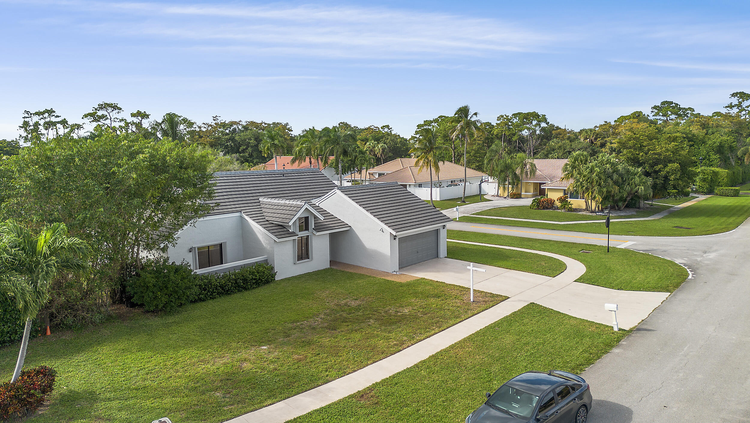 22301 Ensenada Way Boca Raton, FL 33433 - Photo 37 of 44 an aerial view of a house with swimming pool garden and trees