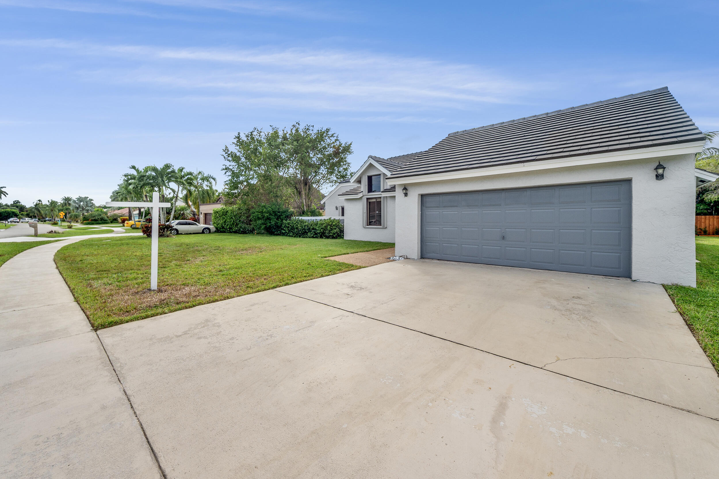 22301 Ensenada Way Boca Raton, FL 33433 - Photo 8 of 44 front view of a house with a yard