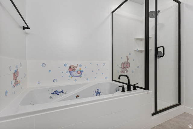3473 Hardman Way Lehi, UT 84048 - Photo 13 of 22 Bathroom with a tub with jets and a stall shower