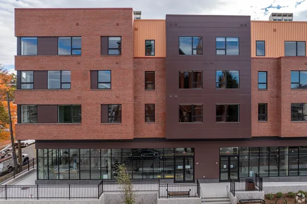 a front view of a building with glass windows