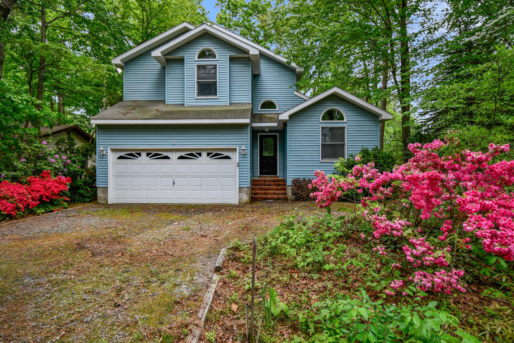 70 Capetown Road Ocean Pines, MD 21811 - Photo 4 of 48 Charming home amidst vibrant blooms.