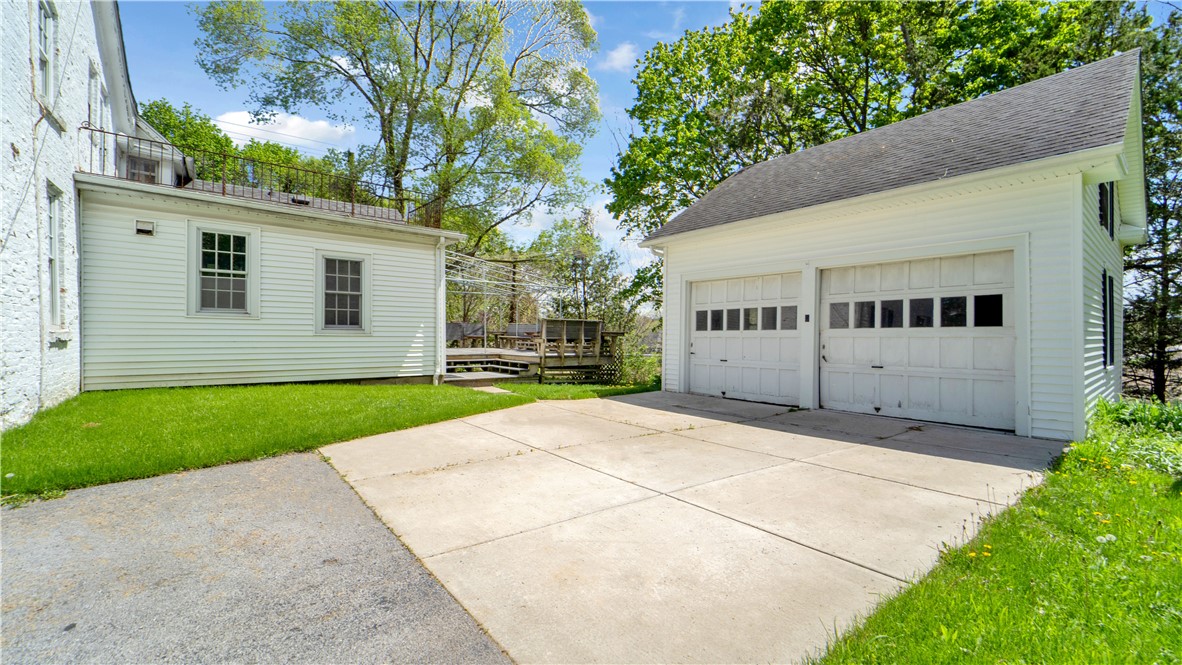 150 William Kidder Road Lancaster, NY 14086 - Photo 4 of 39 A ground-level view of the rear exterior and detac