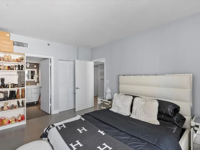 a living room with a couch and a book shelf