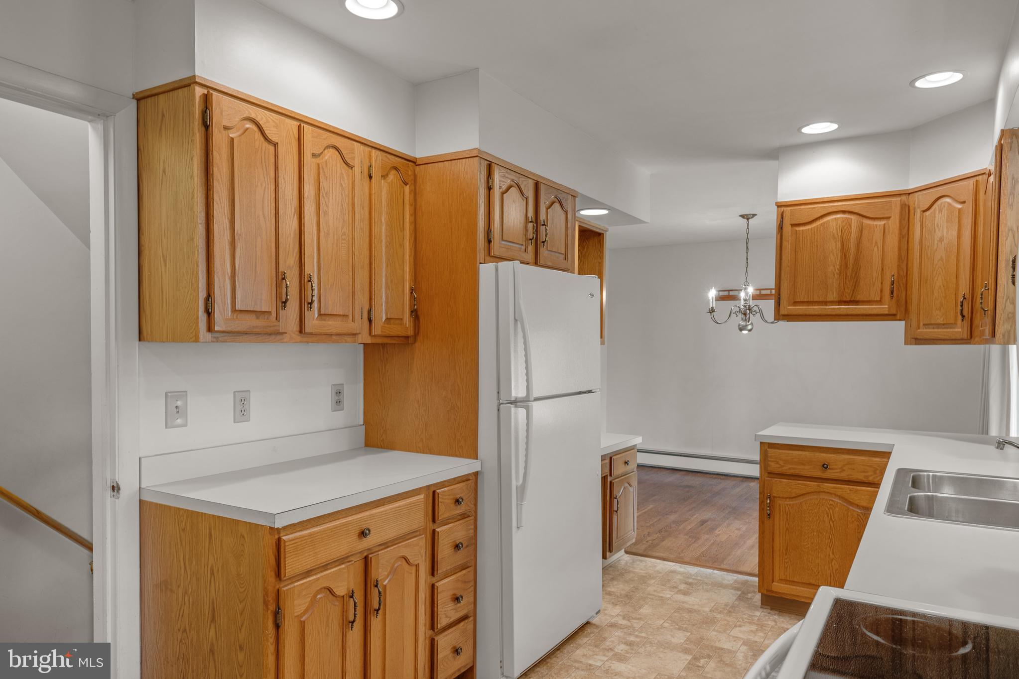 27 Pfautz Avenue Lititz, PA 17543 - Photo 13 of 25 a kitchen with a refrigerator a sink and cabinets
