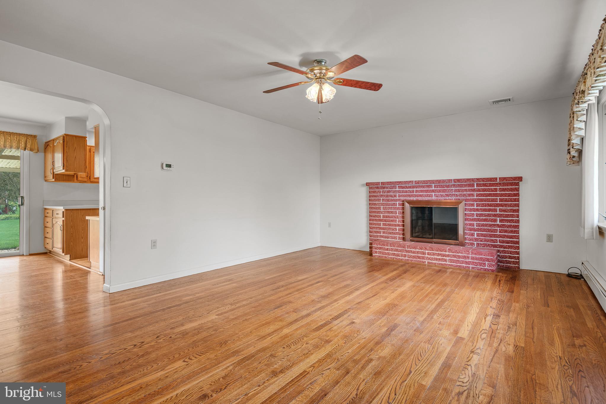 27 Pfautz Avenue Lititz, PA 17543 - Photo 7 of 25 a view of an empty room with wooden floor and a window