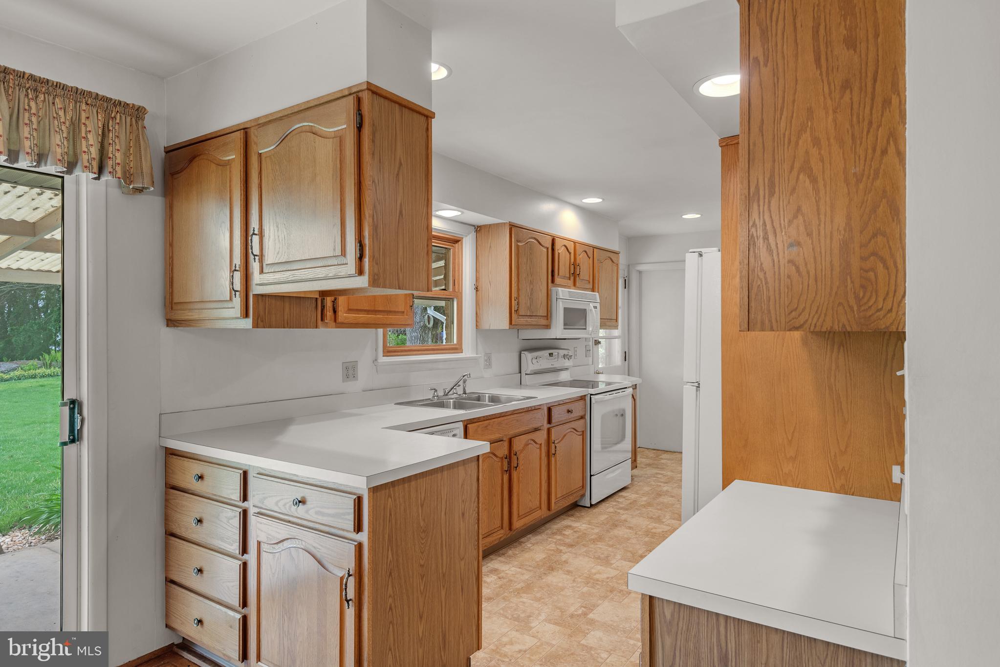 27 Pfautz Avenue Lititz, PA 17543 - Photo 10 of 25 a kitchen with a sink stove and refrigerator