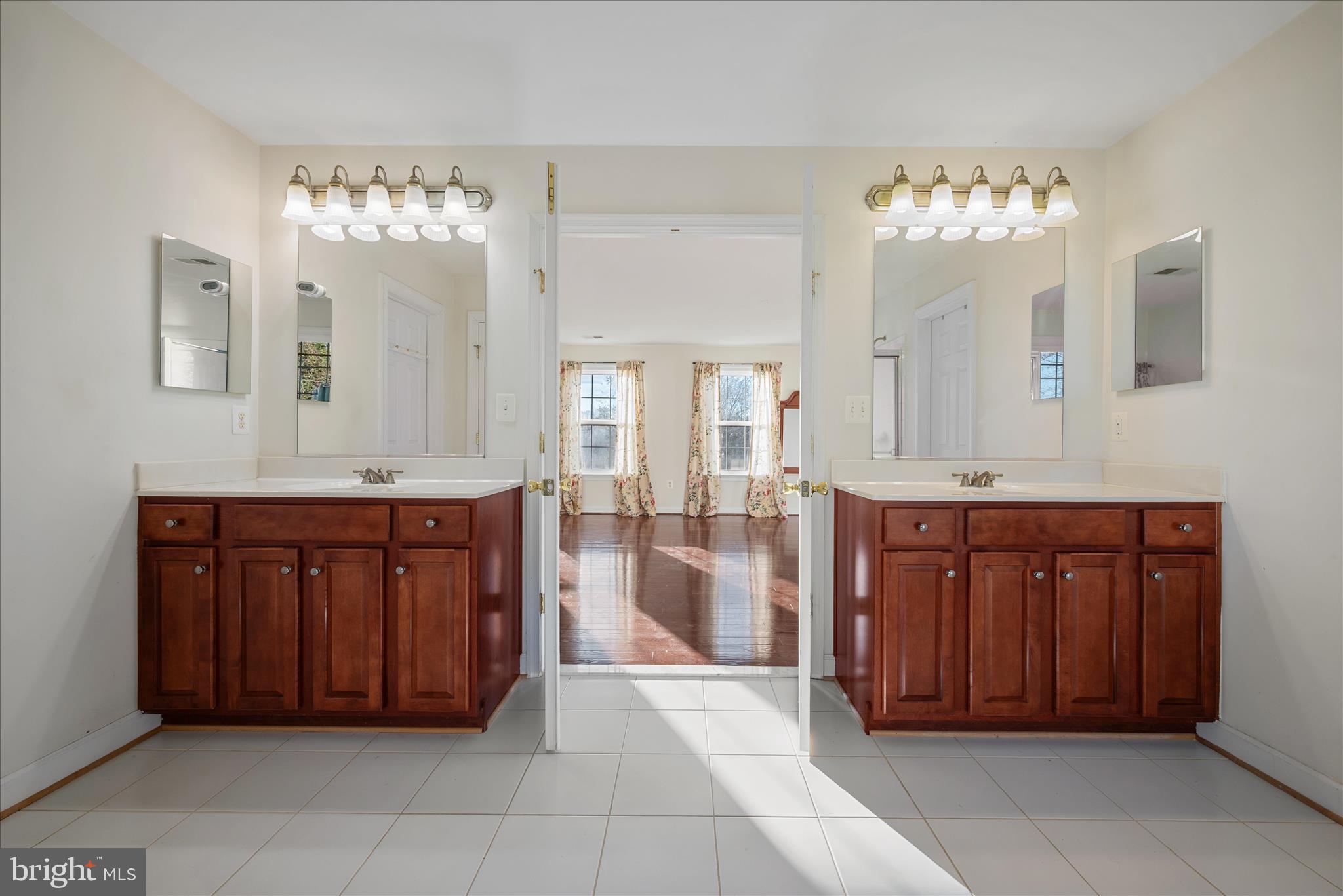 5051 Ridgeview Court Jeffersonton, VA 22724 - Photo 14 of 29 a spacious bathroom with a granite countertop double vanity sink a mirror and a bathtub