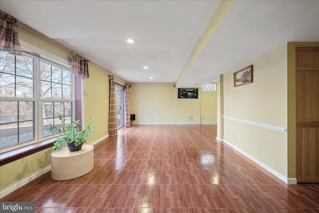 a view of an entryway with wooden floor