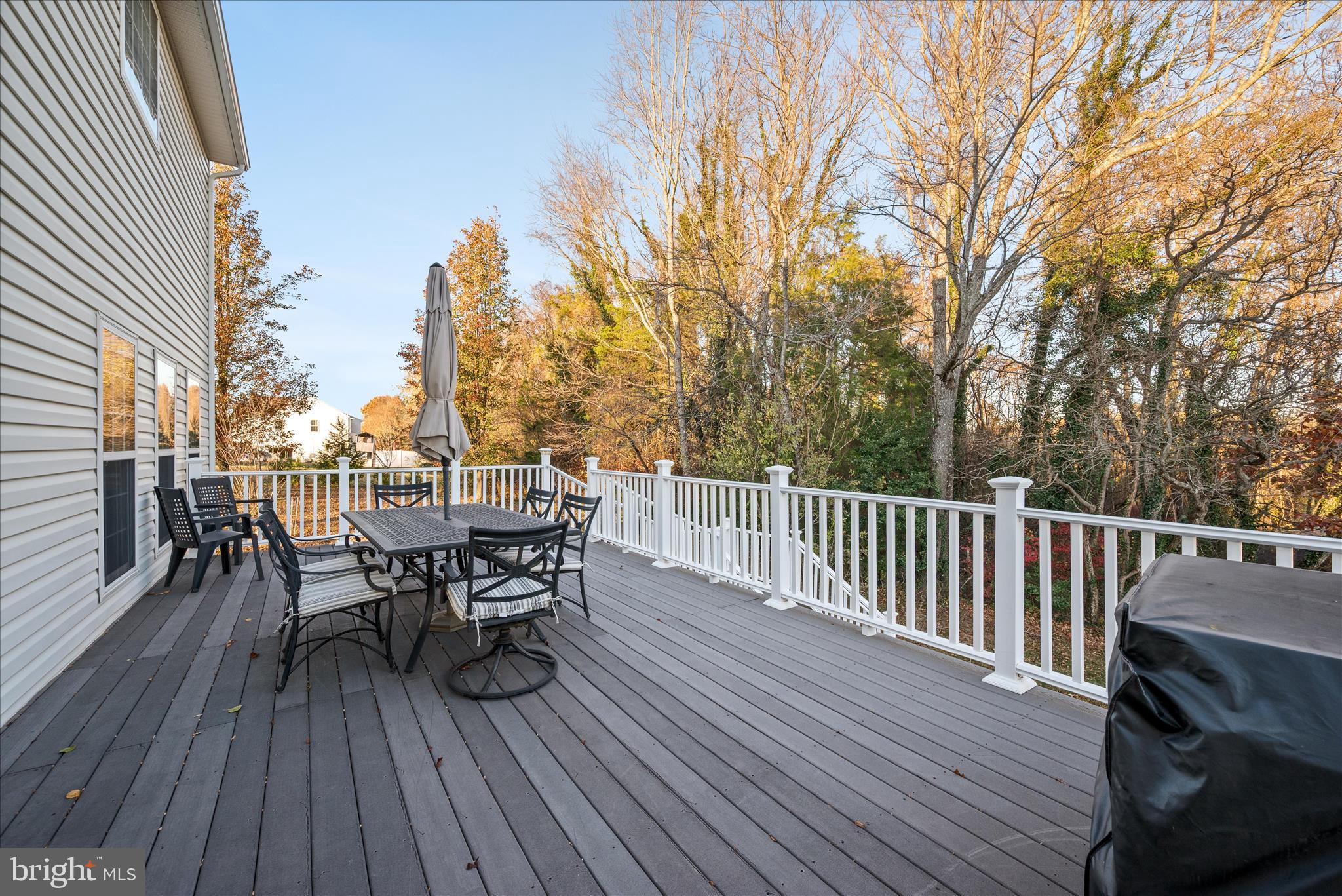 5051 Ridgeview Court Jeffersonton, VA 22724 - Photo 21 of 29 a view of a roof deck with table and chairs and wooden floor