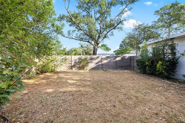 a backyard of a house with lots of green space