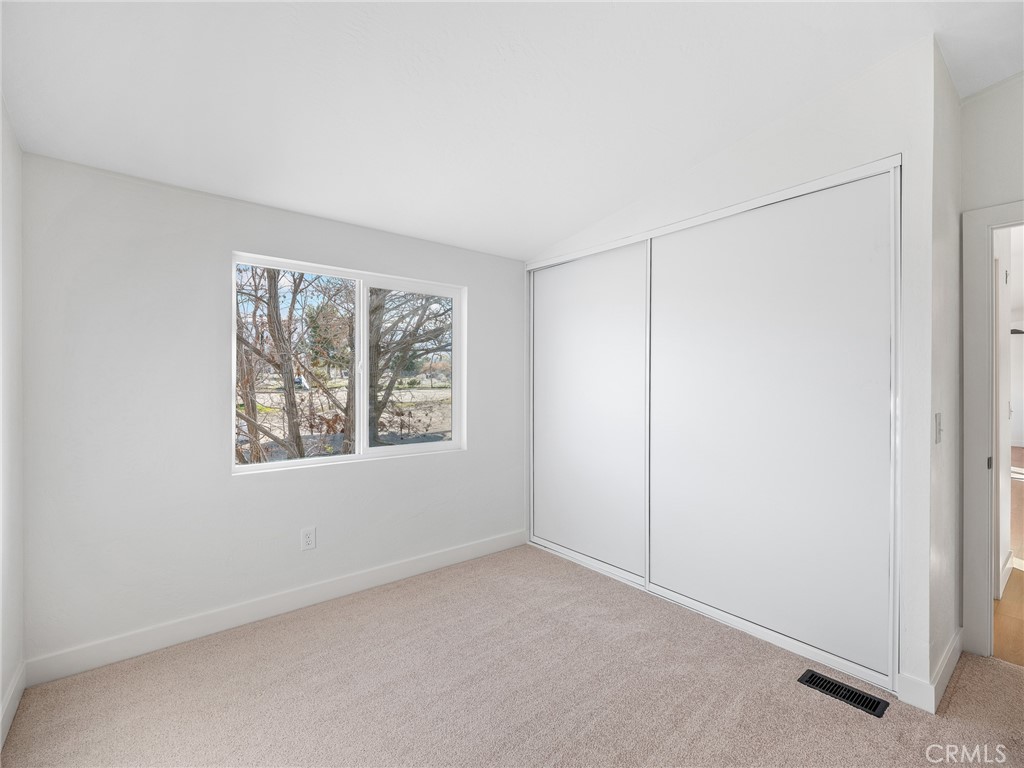 11623 Desert View Road Pinon Hills, CA 92372 - Photo 24 of 47 a view of an empty room with windows