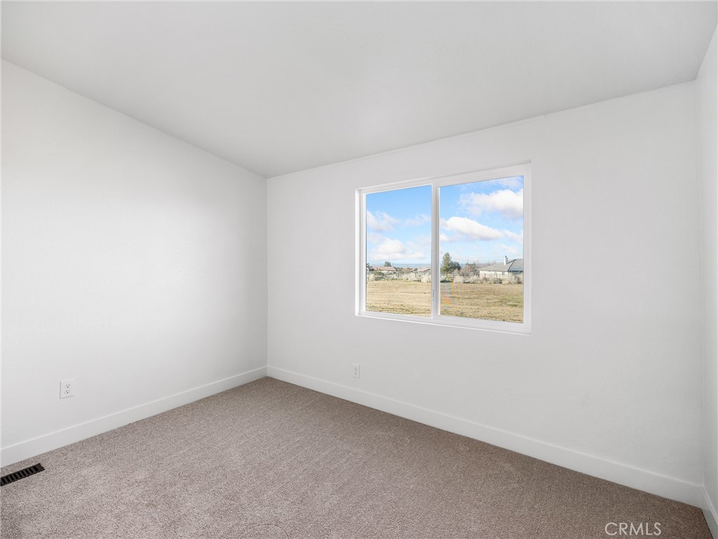 11623 Desert View Road Pinon Hills, CA 92372 - Photo 26 of 47 an empty room with a window