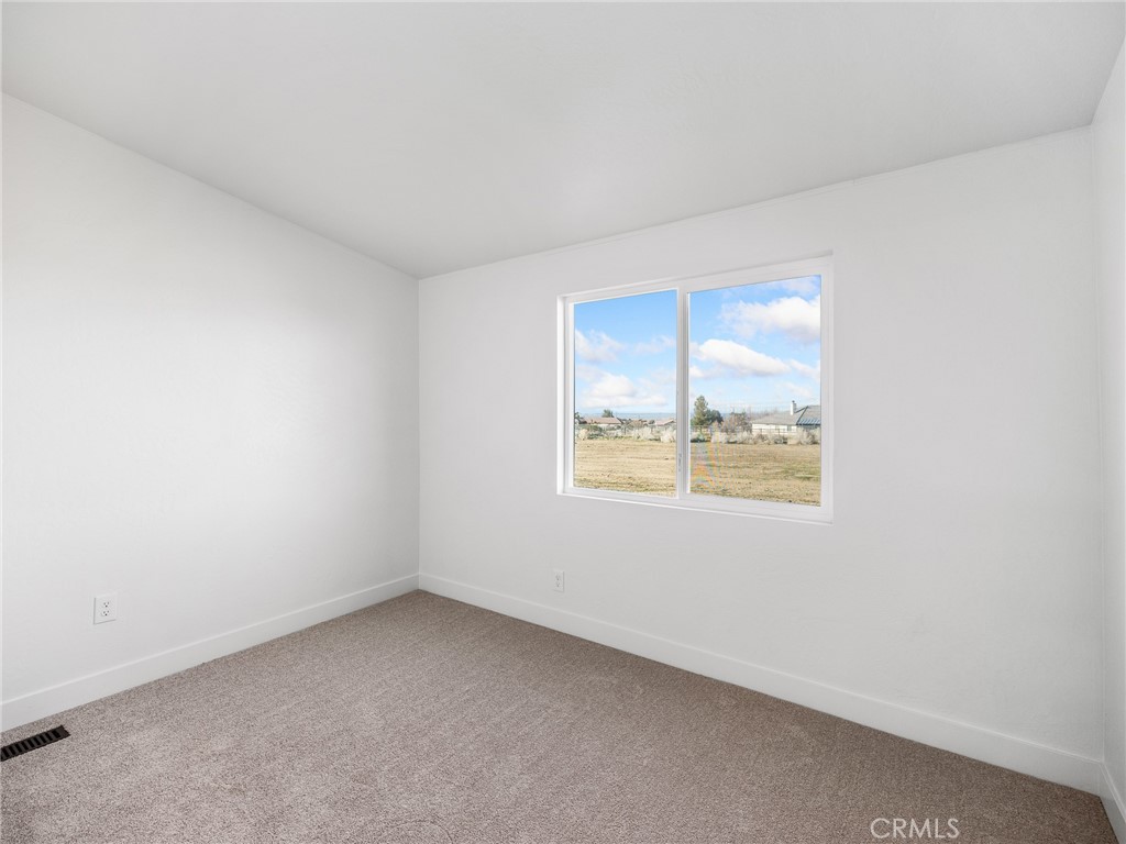 11623 Desert View Road Pinon Hills, CA 92372 - Photo 26 of 47 an empty room with a window