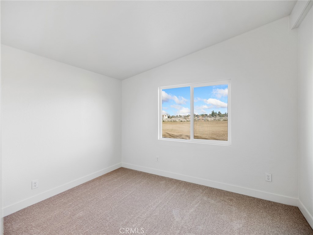 11623 Desert View Road Pinon Hills, CA 92372 - Photo 29 of 47 an empty room with a window