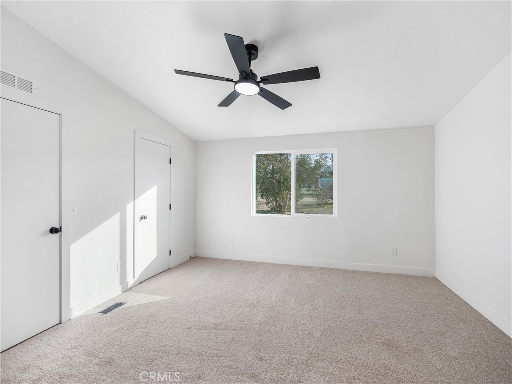 11623 Desert View Road Pinon Hills, CA 92372 - Photo 31 of 47 a view of an empty room with a window
