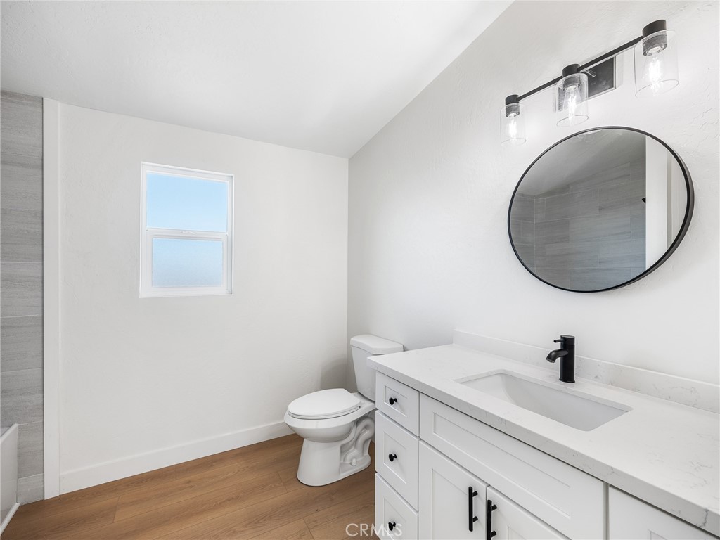 11623 Desert View Road Pinon Hills, CA 92372 - Photo 34 of 47 a white toilet sitting next to a bathroom sink