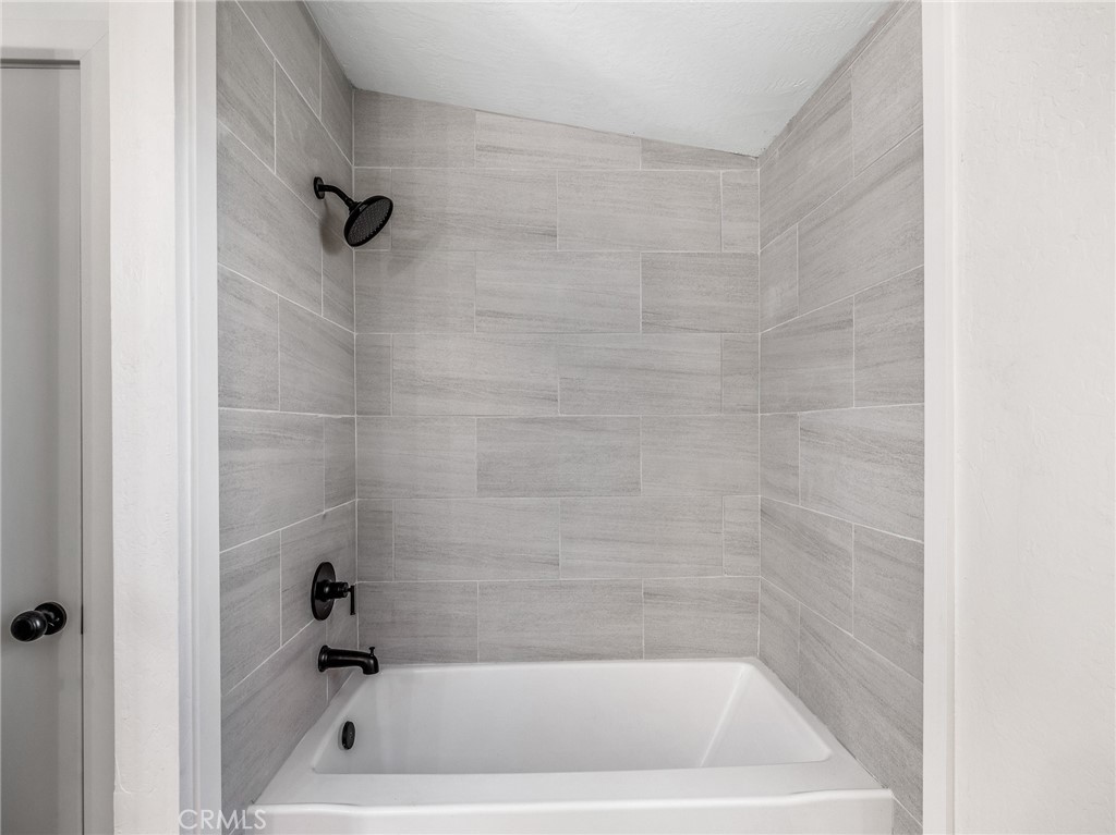 11623 Desert View Road Pinon Hills, CA 92372 - Photo 35 of 47 a bath tub sitting next to a white sink