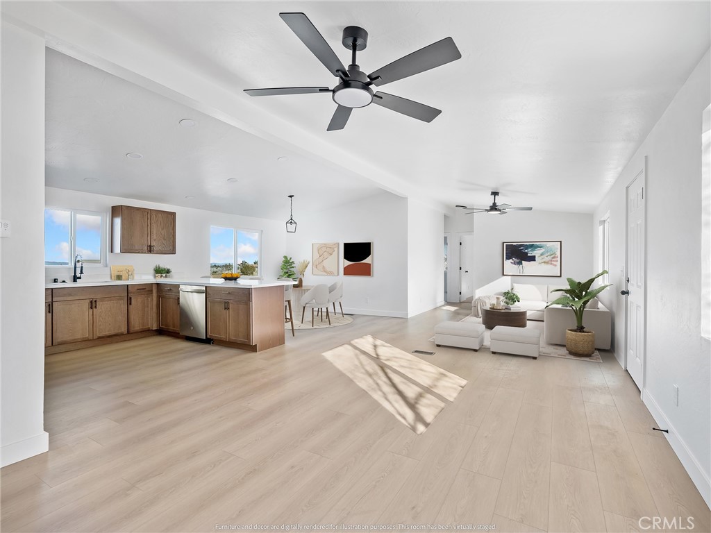 11623 Desert View Road Pinon Hills, CA 92372 - Photo 6 of 47 a view of a livingroom with furniture and a ceiling fan