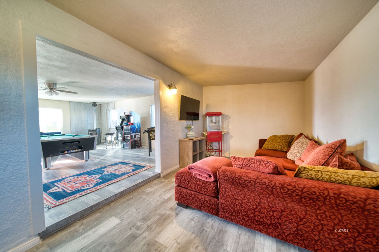 4047 Felspar Avenue Ridgecrest, CA 93555 - Photo 14 of 49 a living room with furniture and a flat screen tv