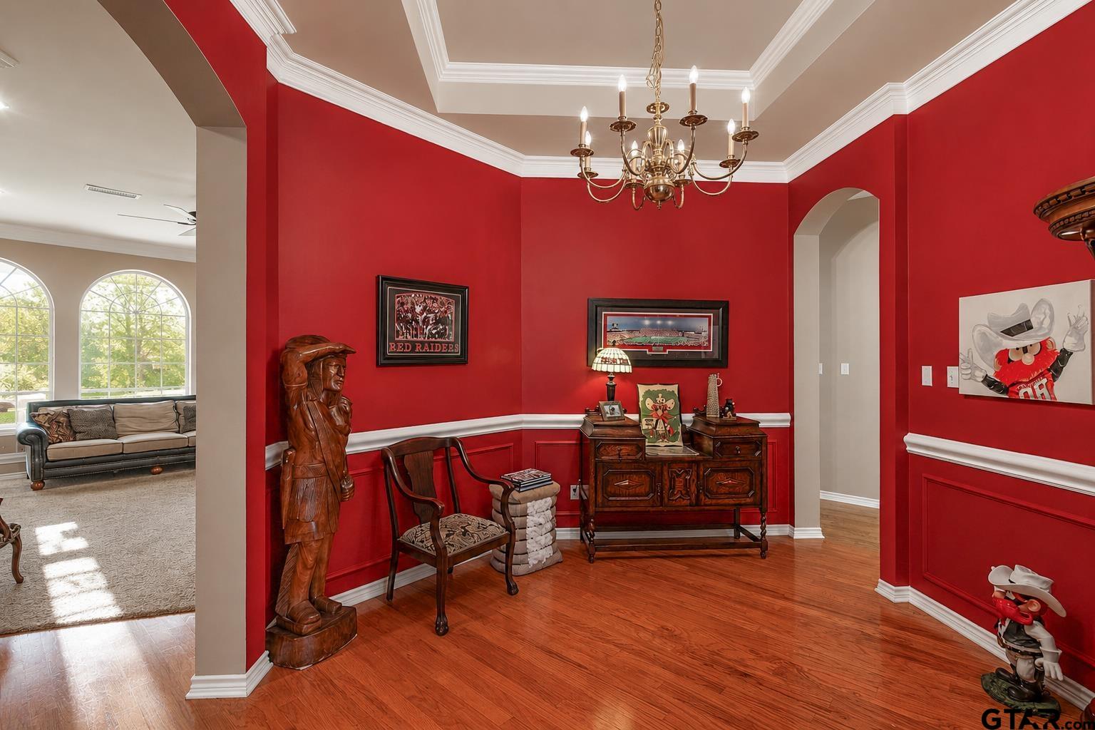 1388 Santa Fe Trail Tyler, TX 75703 - Photo 18 of 46 a view of a room with furniture wooden floor and chandelier
