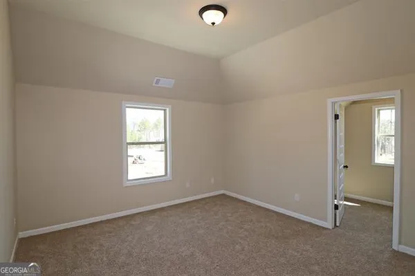 an empty room that has a window