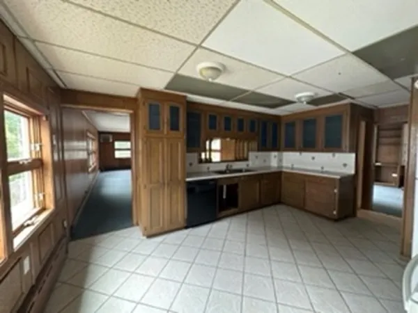 a kitchen with a sink and cabinets