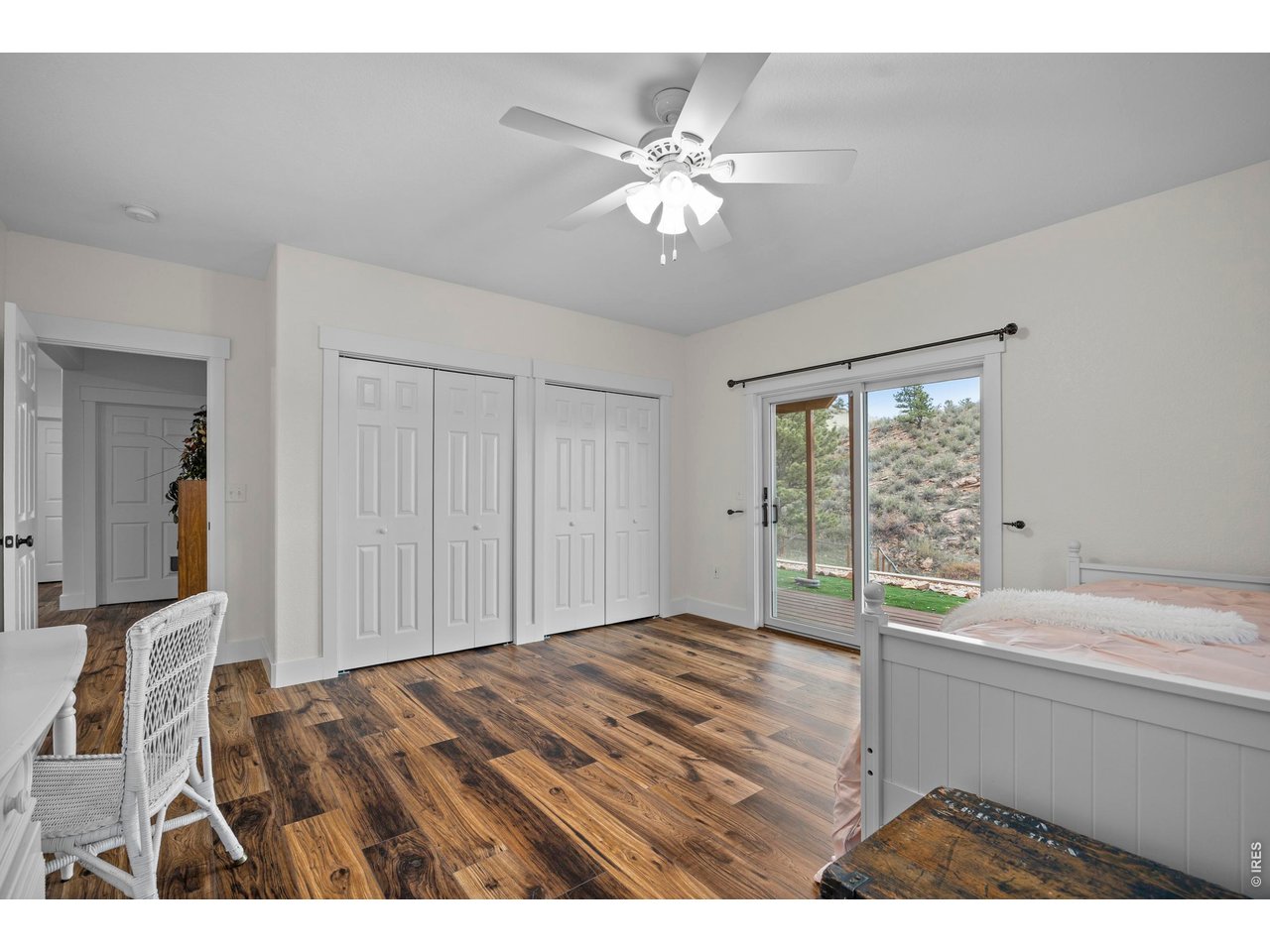8609 Ranch Road Loveland, CO 80537 - Photo 24 of 44 Basement Bedroom Walks Out to Covered Deck