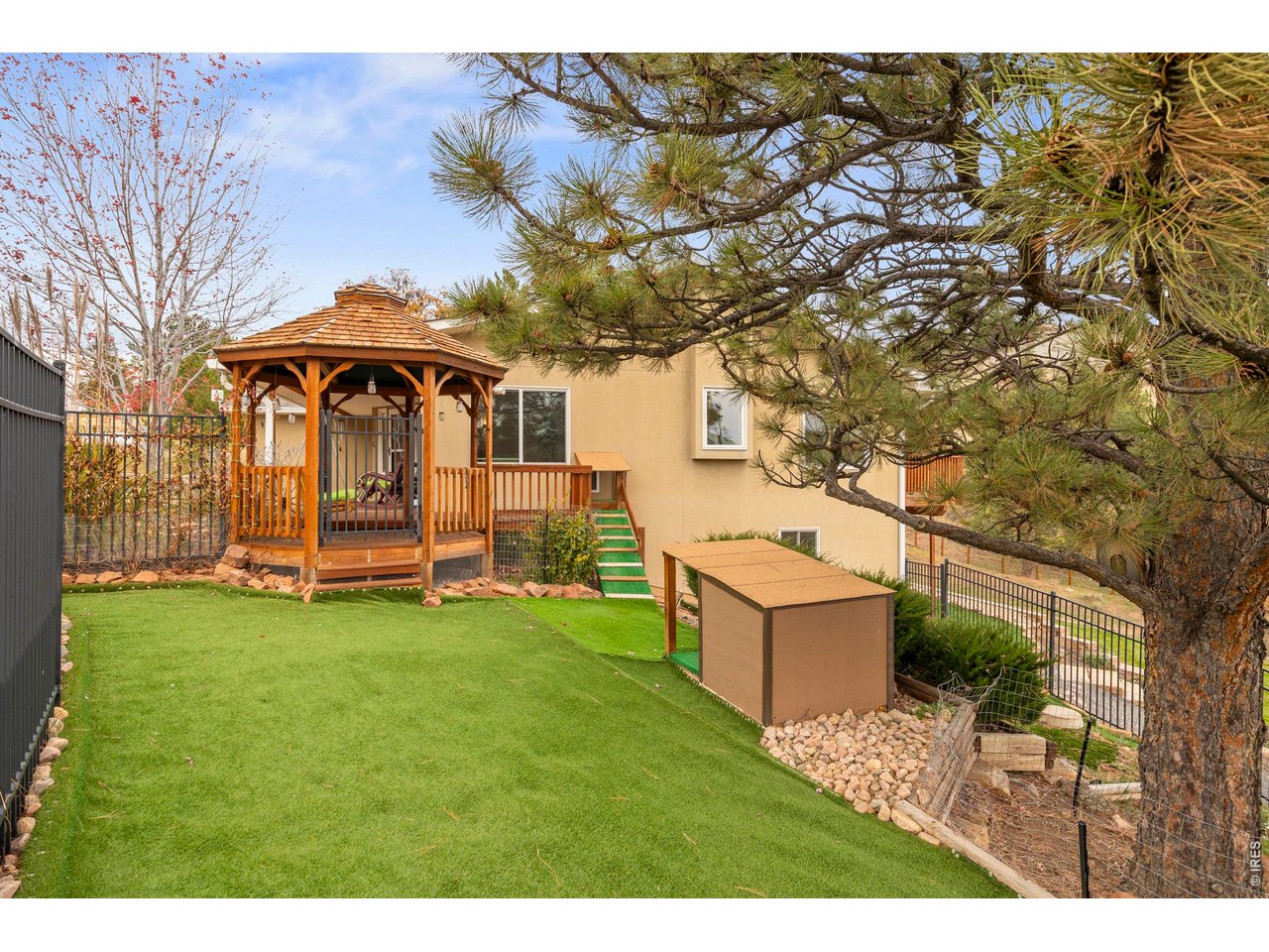 8609 Ranch Road Loveland, CO 80537 - Photo 28 of 44 Gazebo in Back Yard and Dog Run with Artificial Turf
