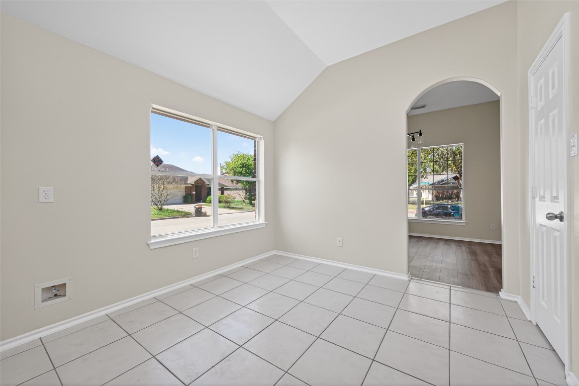 19902 Chaste Tree Lane Humble, TX 77338 - Photo 14 of 43 a view of an empty room with window and cabinet