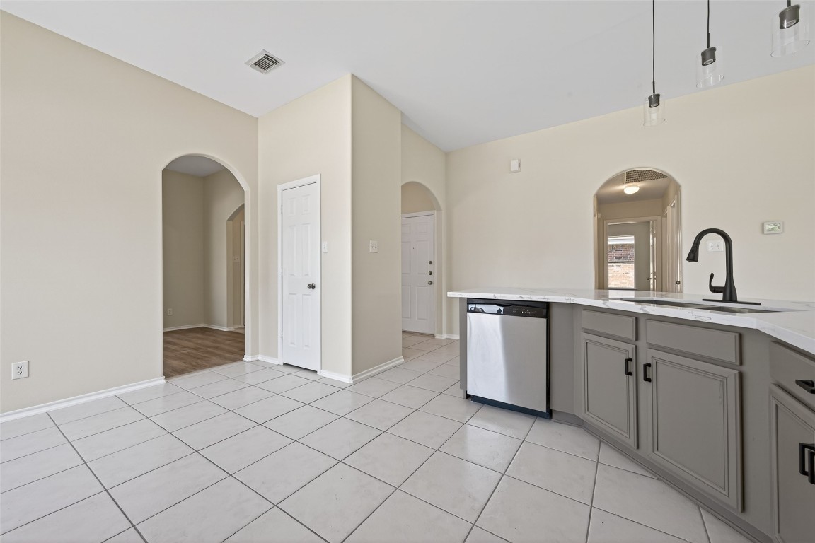 19902 Chaste Tree Lane Humble, TX 77338 - Photo 15 of 43 a kitchen with a sink and cabinets