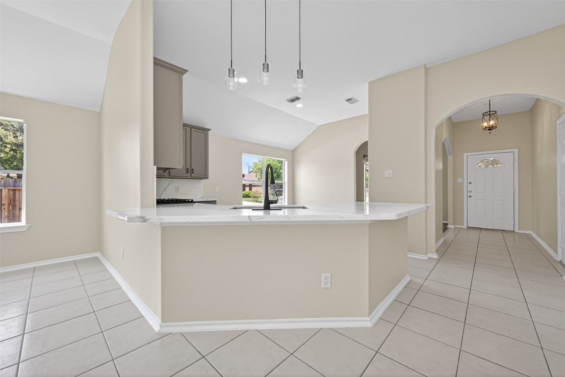 19902 Chaste Tree Lane Humble, TX 77338 - Photo 16 of 43 a large white kitchen with cabinets and a window