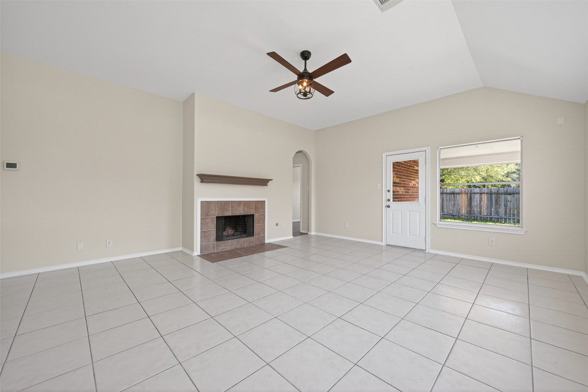 19902 Chaste Tree Lane Humble, TX 77338 - Photo 19 of 43 an empty room with windows and fireplace