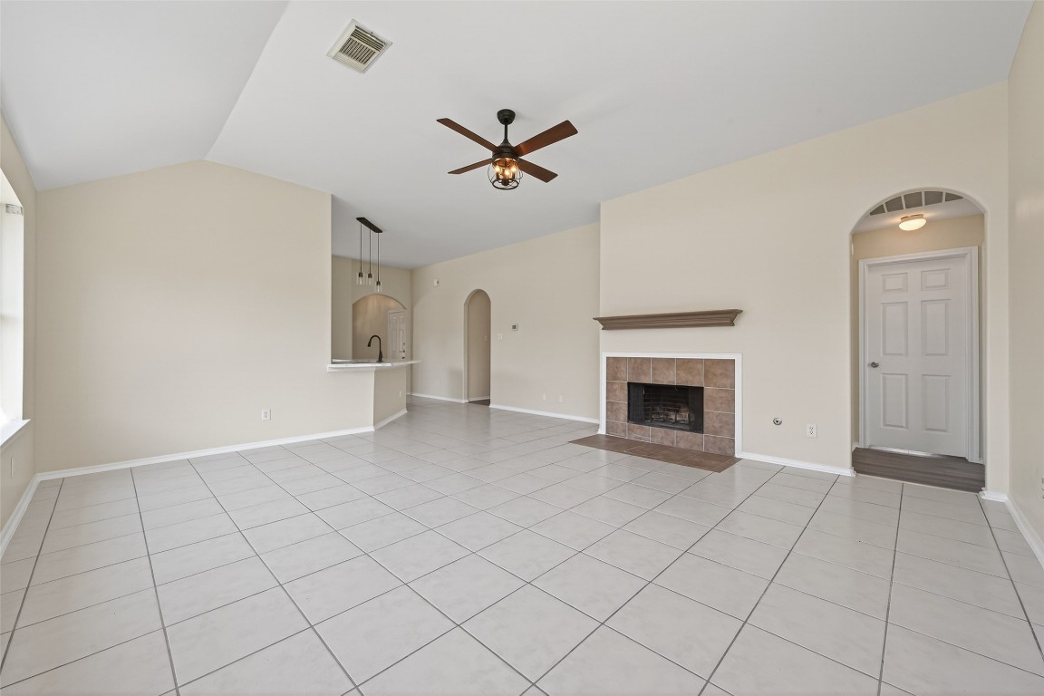 19902 Chaste Tree Lane Humble, TX 77338 - Photo 20 of 43 an empty room with windows and fireplace