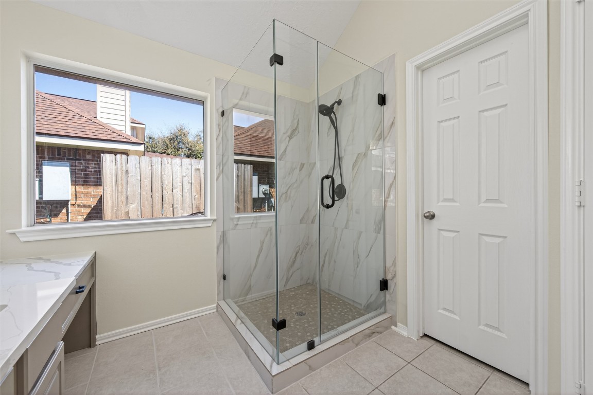 19902 Chaste Tree Lane Humble, TX 77338 - Photo 24 of 43 a bathroom with a shower