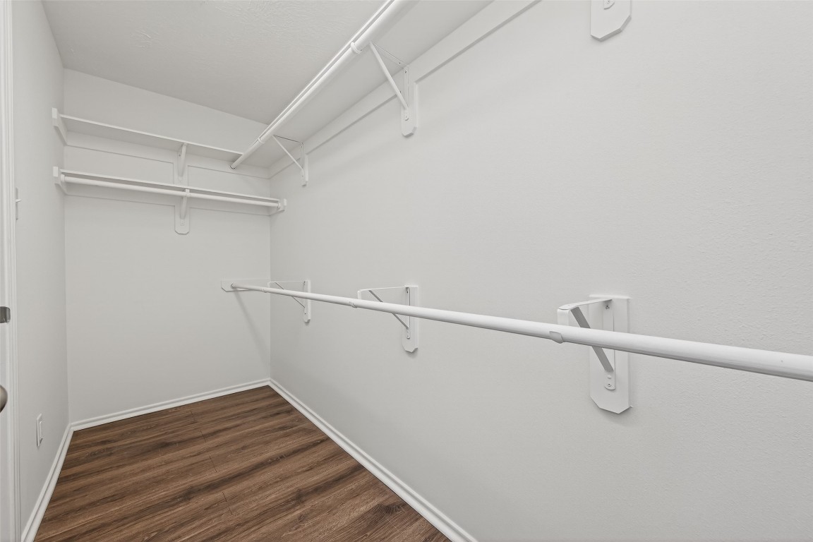 19902 Chaste Tree Lane Humble, TX 77338 - Photo 26 of 43 a view of a room with racks on the wall