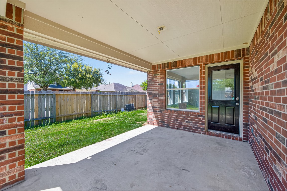 19902 Chaste Tree Lane Humble, TX 77338 - Photo 40 of 43 a view of a porch with wooden floor and fence
