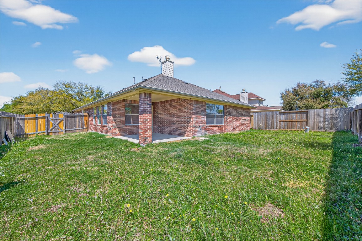 19902 Chaste Tree Lane Humble, TX 77338 - Photo 41 of 43 a front view of a house with garden