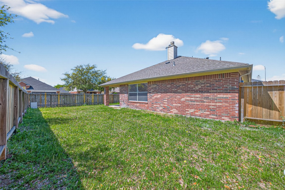 19902 Chaste Tree Lane Humble, TX 77338 - Photo 42 of 43 a front view of a house with garden