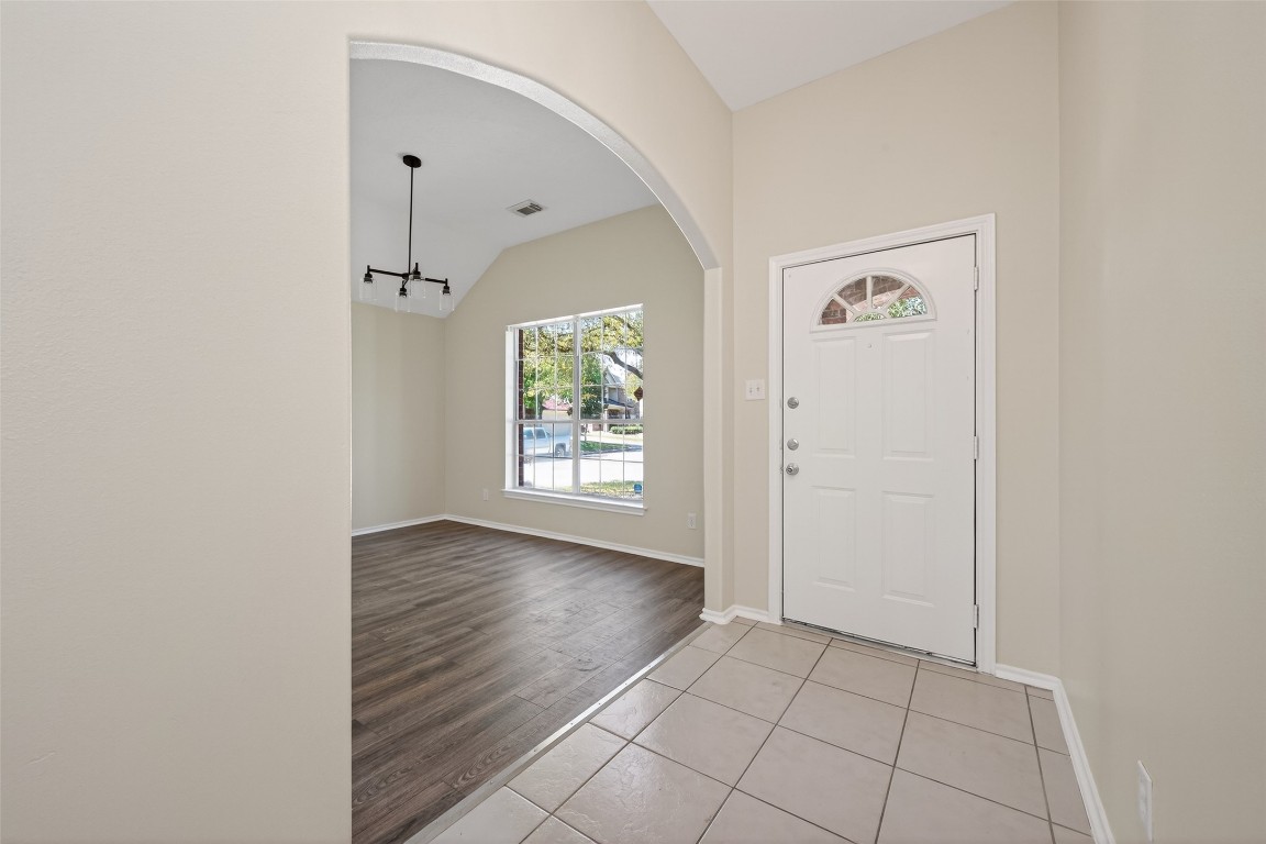 19902 Chaste Tree Lane Humble, TX 77338 - Photo 5 of 43 an empty room with windows and closet