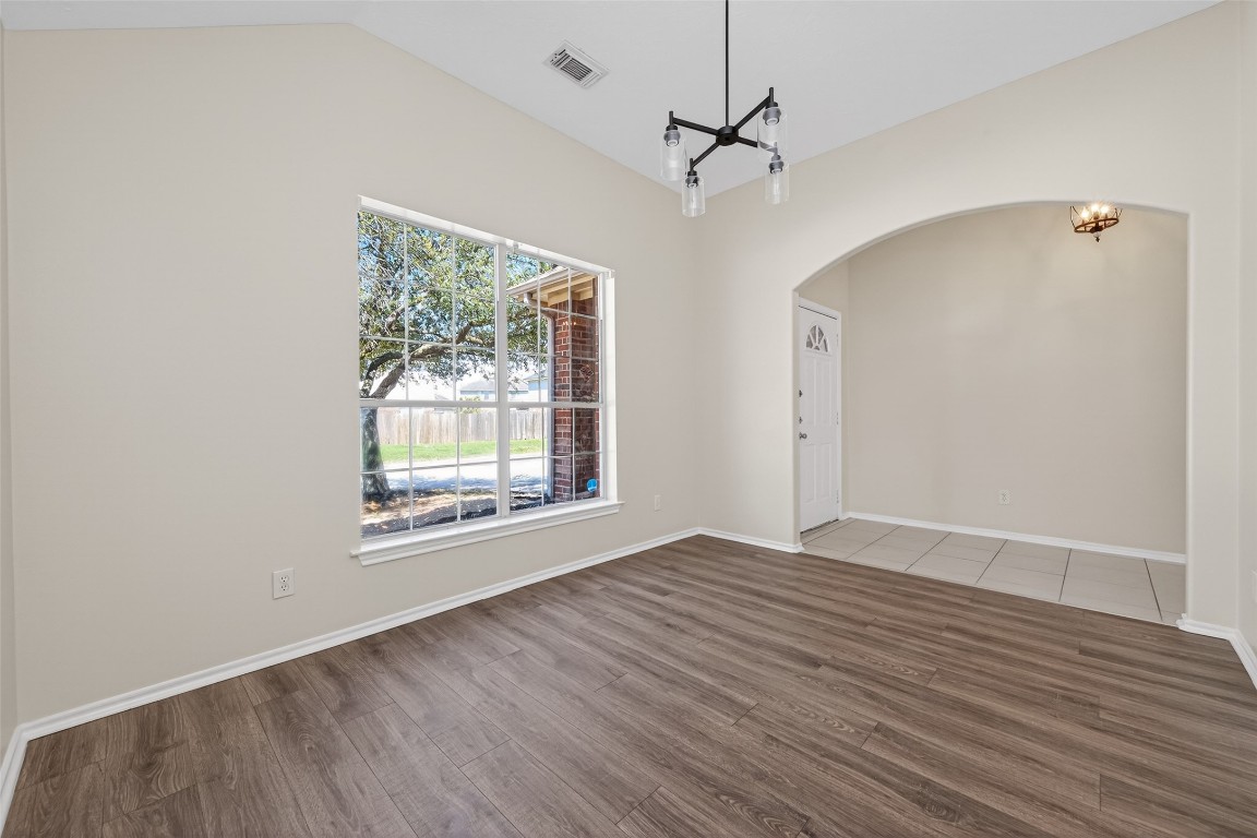 19902 Chaste Tree Lane Humble, TX 77338 - Photo 7 of 43 wooden floor in an empty room with a window