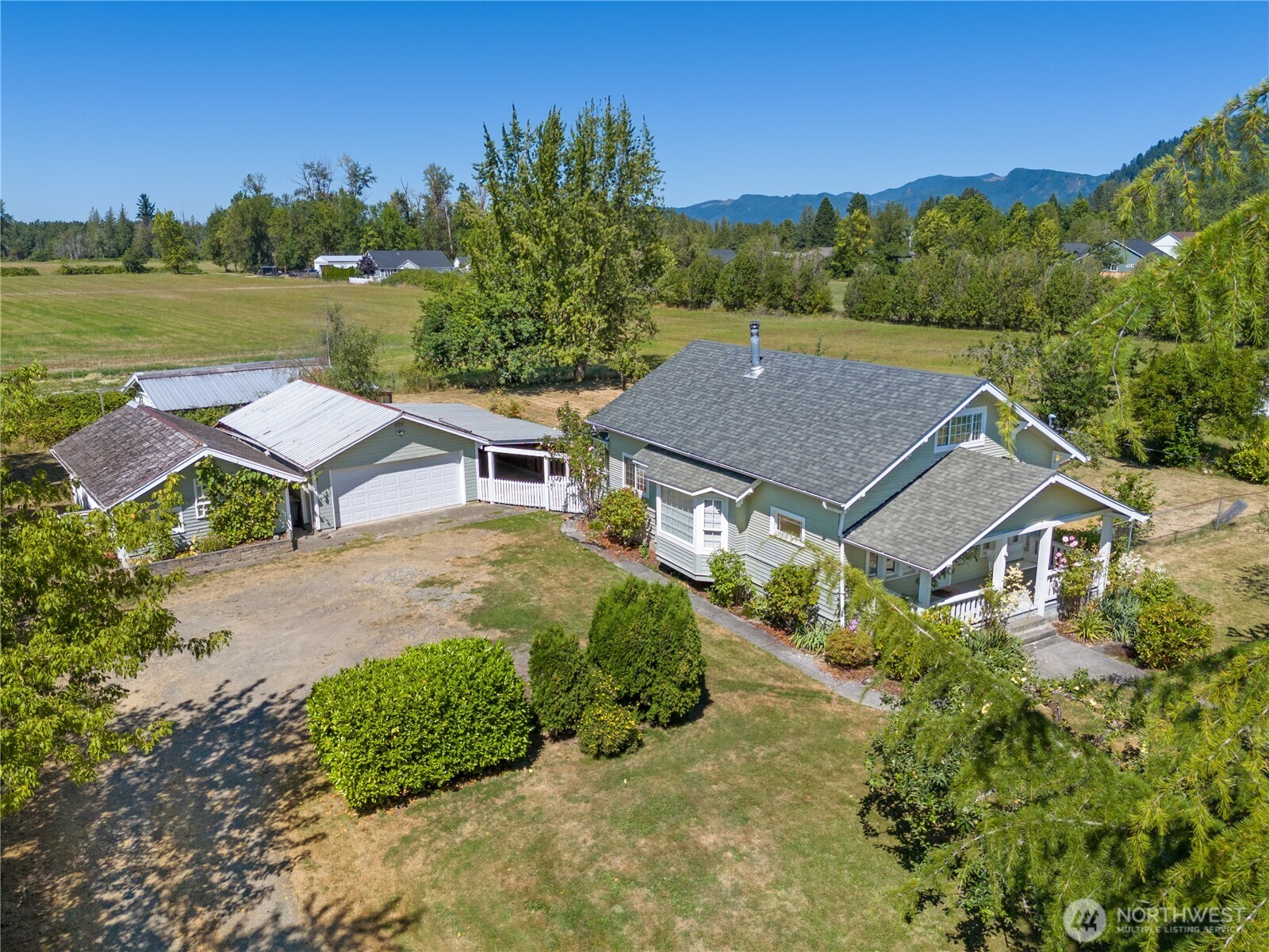 a aerial view of a house with a yard