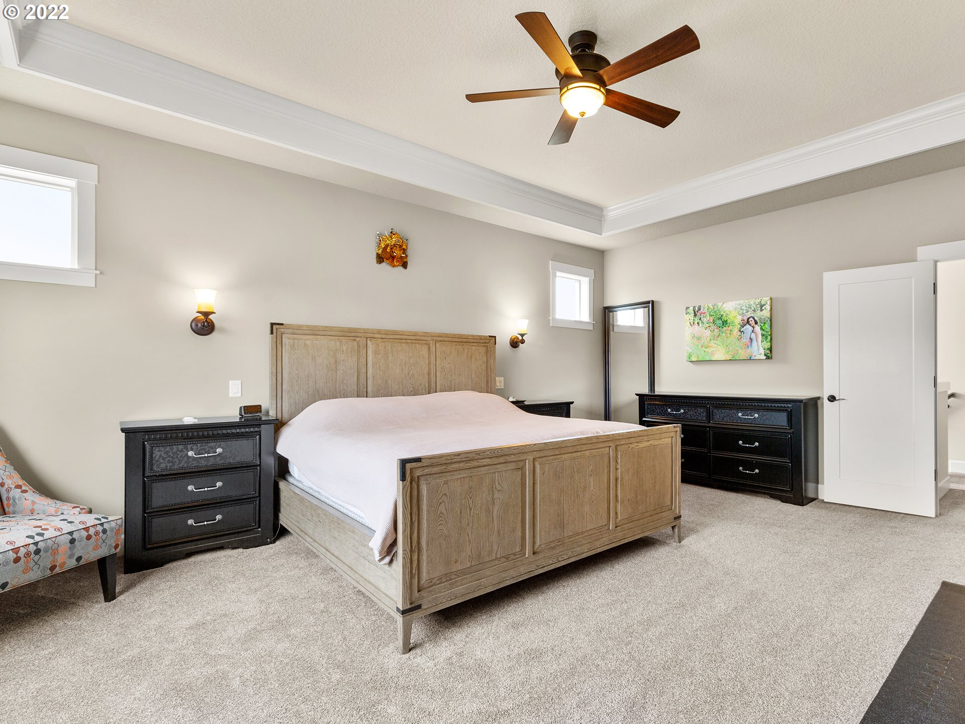 4820 Northwest 209th Street Ridgefield, WA 98642 - Photo 15 of 28 a bed room with a bed and a ceiling fan