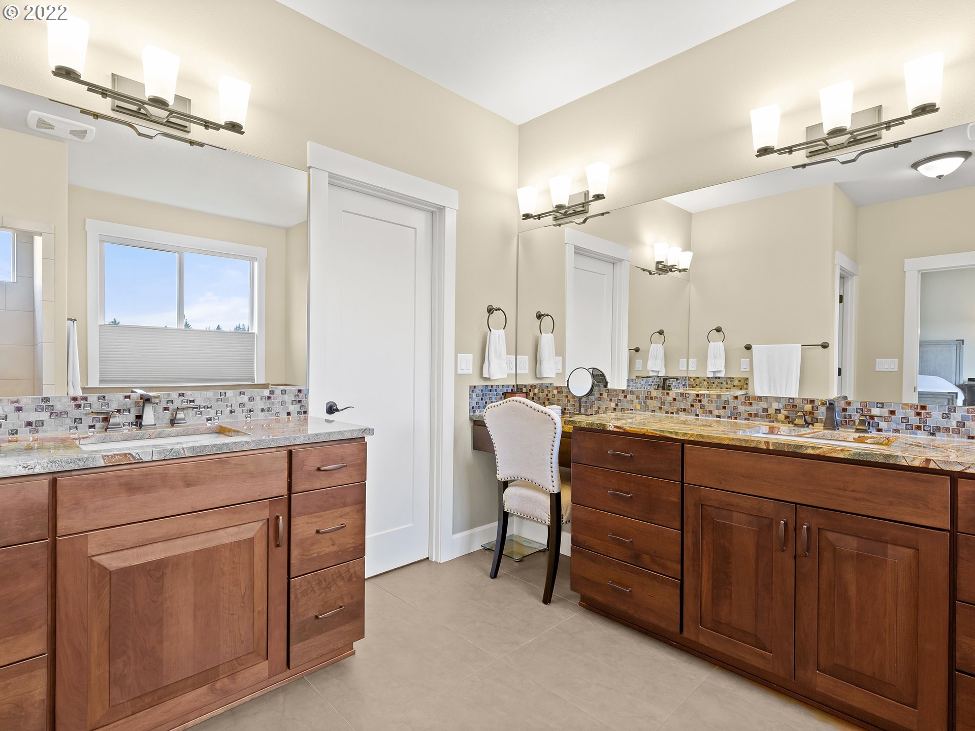 4820 Northwest 209th Street Ridgefield, WA 98642 - Photo 16 of 28 a bathroom with a granite countertop sink a toilet a mirror and shower