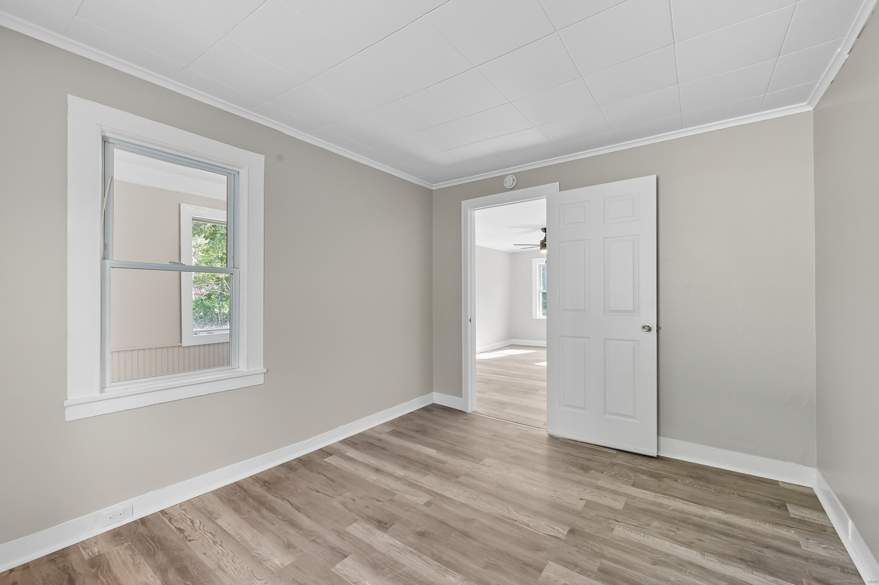 785 Main Street Plymouth, CT 06782 - Photo 14 of 30 a view of an empty room with wooden floor and a window