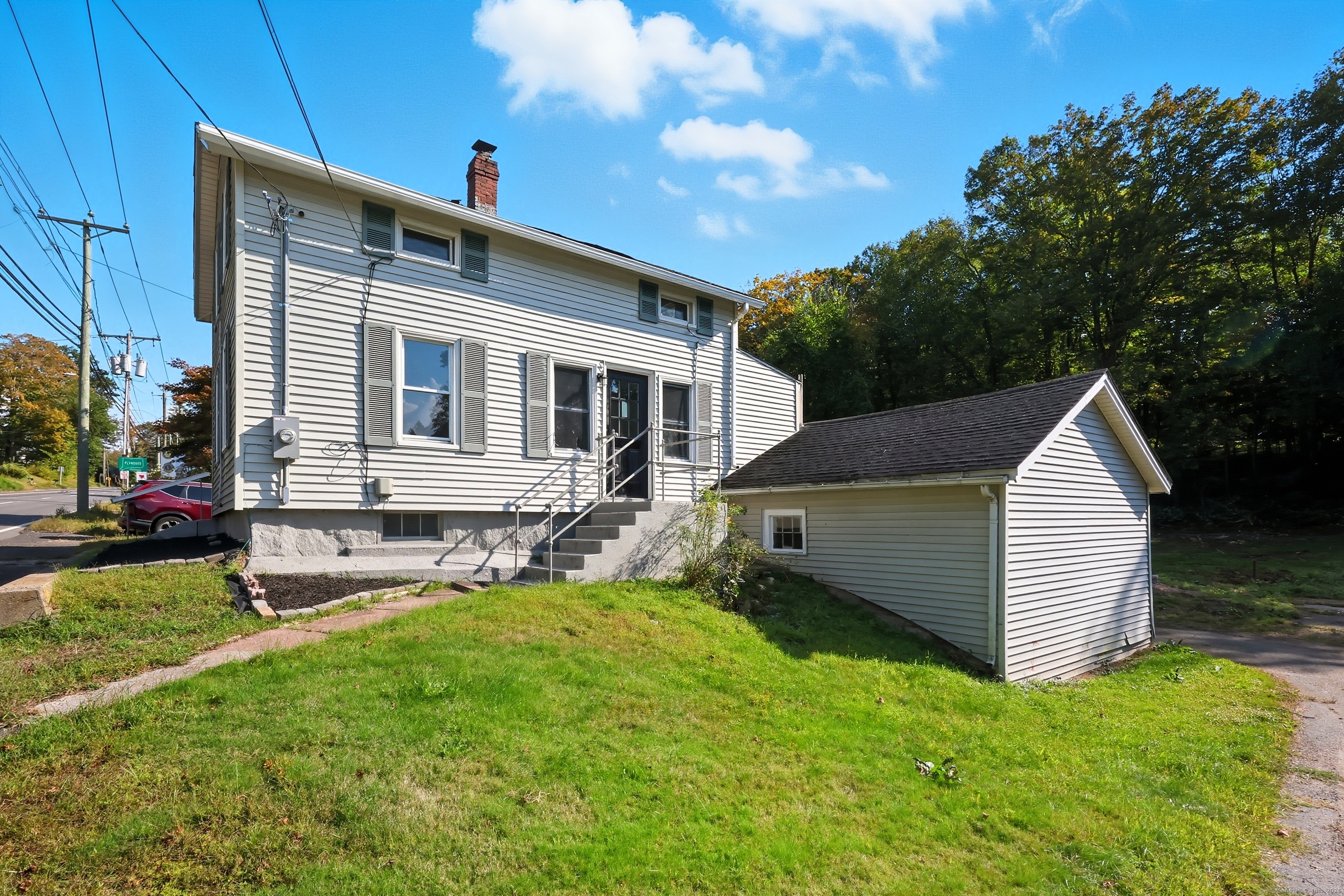 785 Main Street Plymouth, CT 06782 - Photo 23 of 30 a front view of a house with a yard