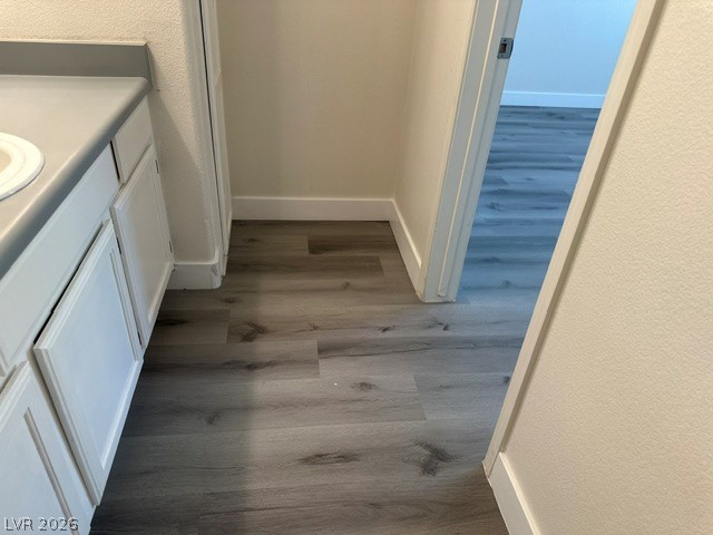 7255 West Sunset Road, Unit 2006 Las Vegas, NV 89113 - Photo 19 of 24 Clean lines and wood-look flooring define this functional bathroom space.