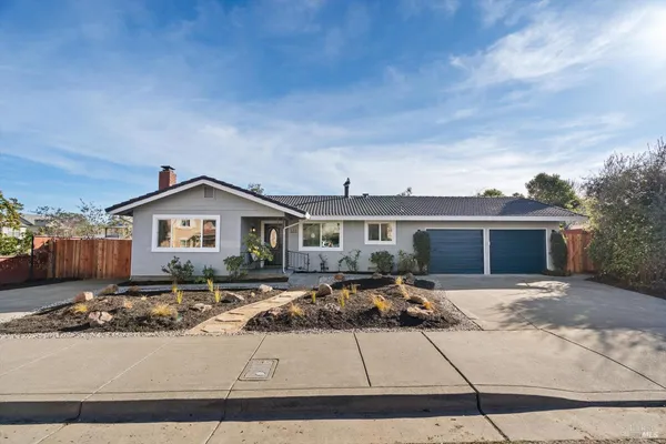 a front view of a house with yard