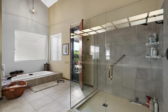 a bathroom with a tub and a shower